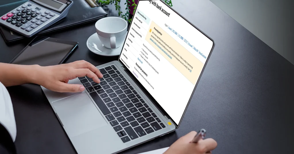 Person using a laptop to manage tax forms online.