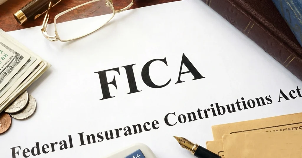 FICA document with money, pen, and office supplies on desk.