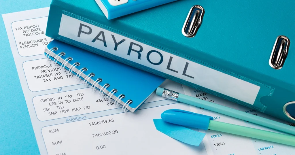 Payroll folder with financial documents and calculator