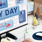 Person managing the accounts payable process on a computer displaying payday graphics.