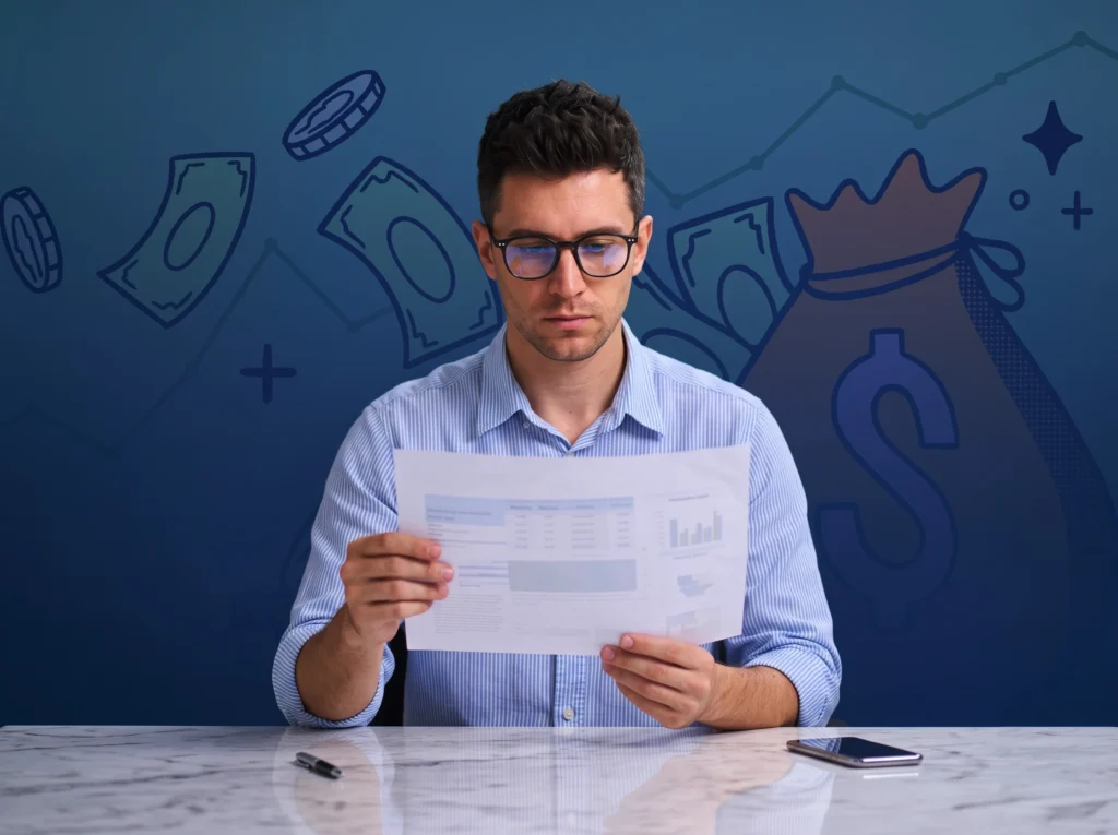 Man reading financial report with money graphics in the background.